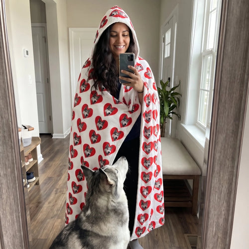 Mirror selfie in a custom pet face hooded blanket with her husky at her feet