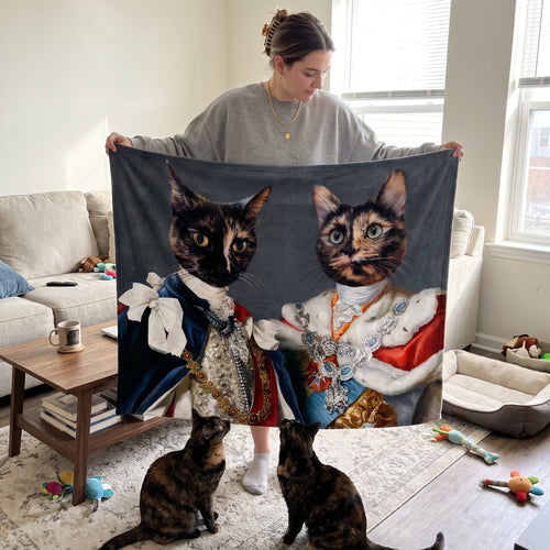 Two tortoiseshell cats with The Rulers custom pet blanket: held up for size