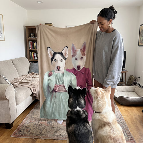Black French bulldog and cream mixed-breed dog with The Sisters custom pet blanket: held up for size