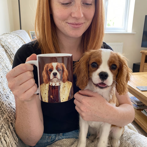 Cavalier King Charles spaniel with The Young King custom mug: owner holding mug + pet